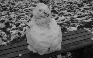 Frozen Snowman on a bench in Warwickshire, England
