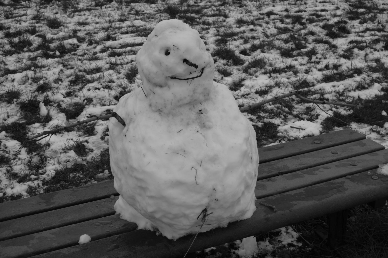 Frozen Snowman on a bench in Warwickshire, England